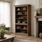 Wycliffe Bookcase in warm recycled pine with textured finish, filled with books and pottery in a cozy living room.