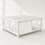 Harbour Coffee Table, coastal-inspired white timber with glass top and crisscross legs.