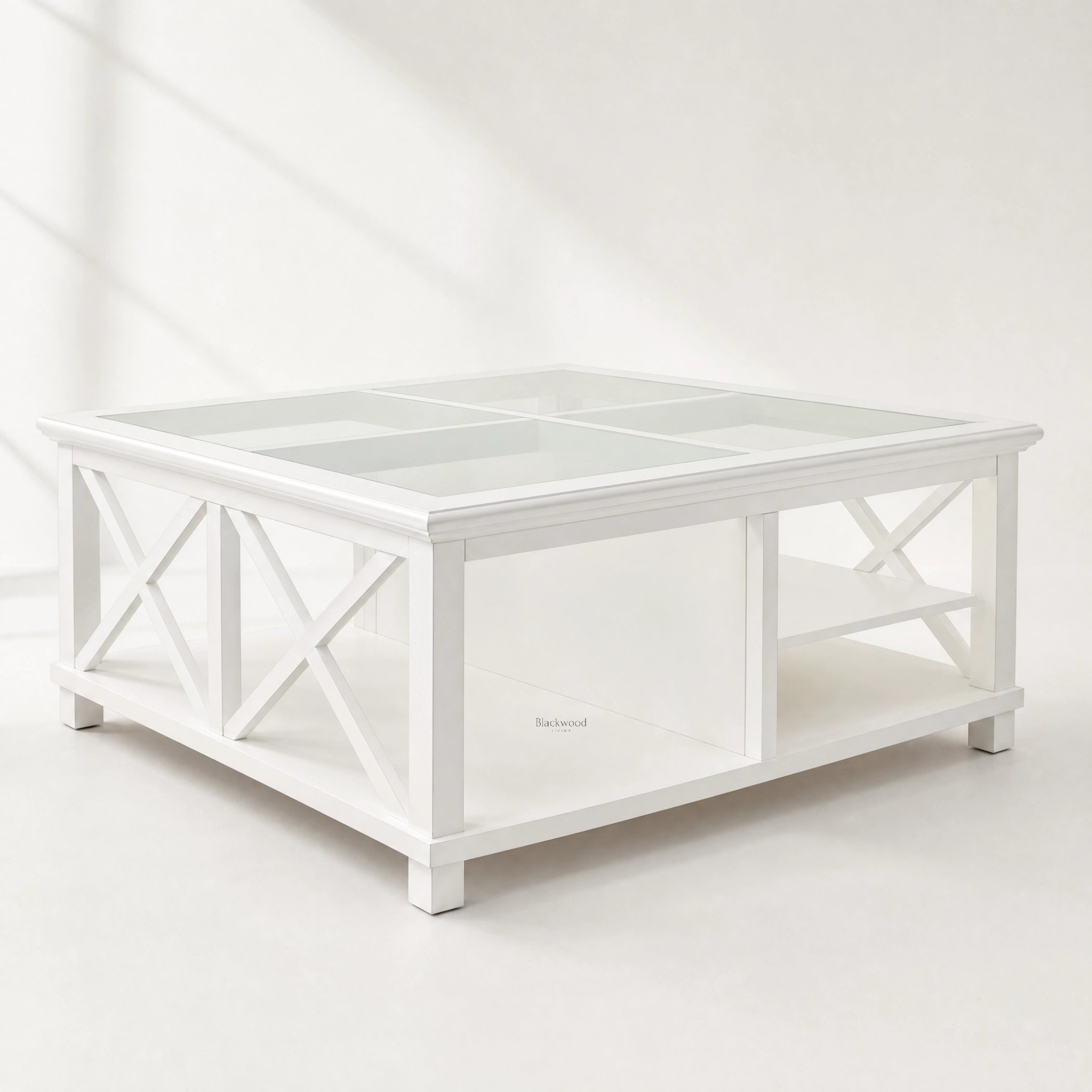 Harbour Coffee Table, coastal-inspired white timber with glass top and crisscross legs.