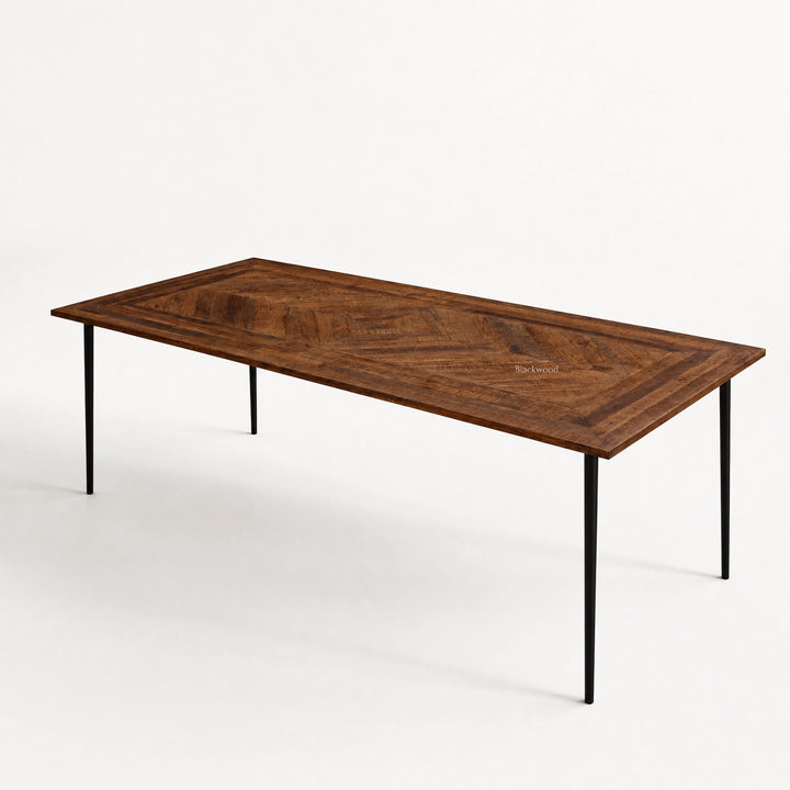 Havana Dining Table with walnut-finished reclaimed mango wood and a chevron parquet top.