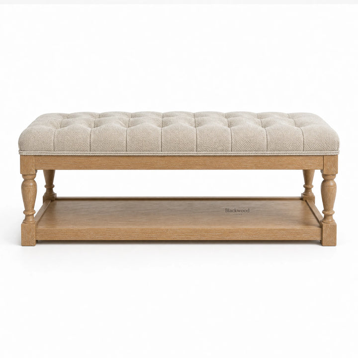Oakfield Bench with sculpted oak frame and tufted beige upholstery, exuding welcoming, traditional style.