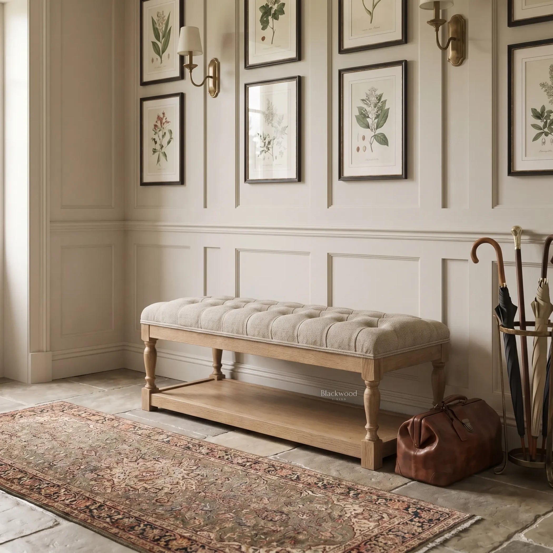 Oakfield Bench with tufted upholstery and sculpted oak frame set against paneled walls with botanical prints.