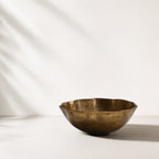 Ankara Gilded Poppy Bowl, handcrafted aluminium with brass finish, undulating form and aged patina.