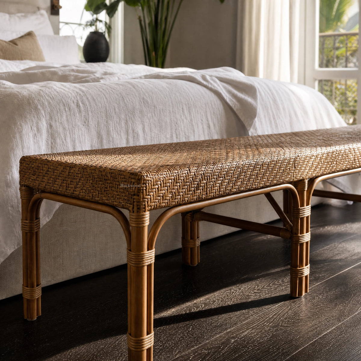Sika Design Luis Bench in natural rattan with a woven top, 180cm long, in a bedroom setting.