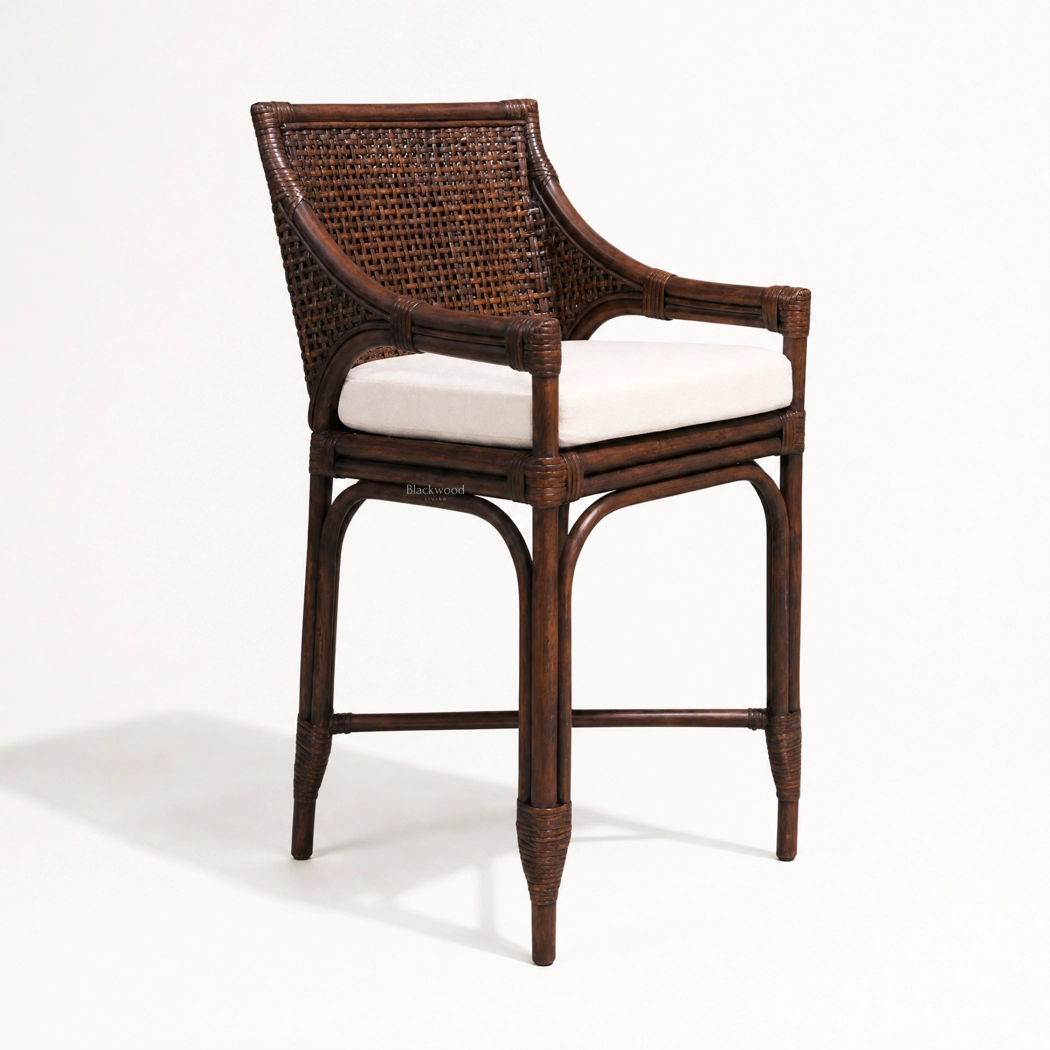 Havana Barstool with woven rattan back and arms, dark wood frame, beige cushioned seat.