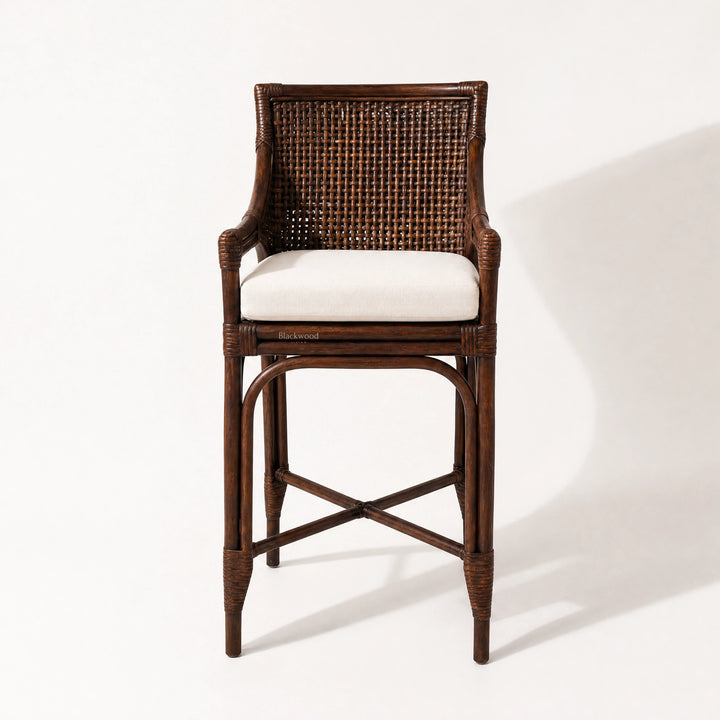 Havana Barstool with natural rattan weave, warm finish, and cushioned seat.