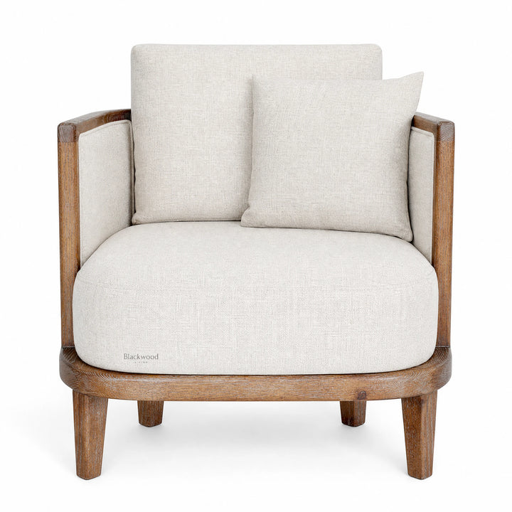 Seabrooke Chair with solid oak frame, handwoven natural rattan panels, and soft linen upholstery.