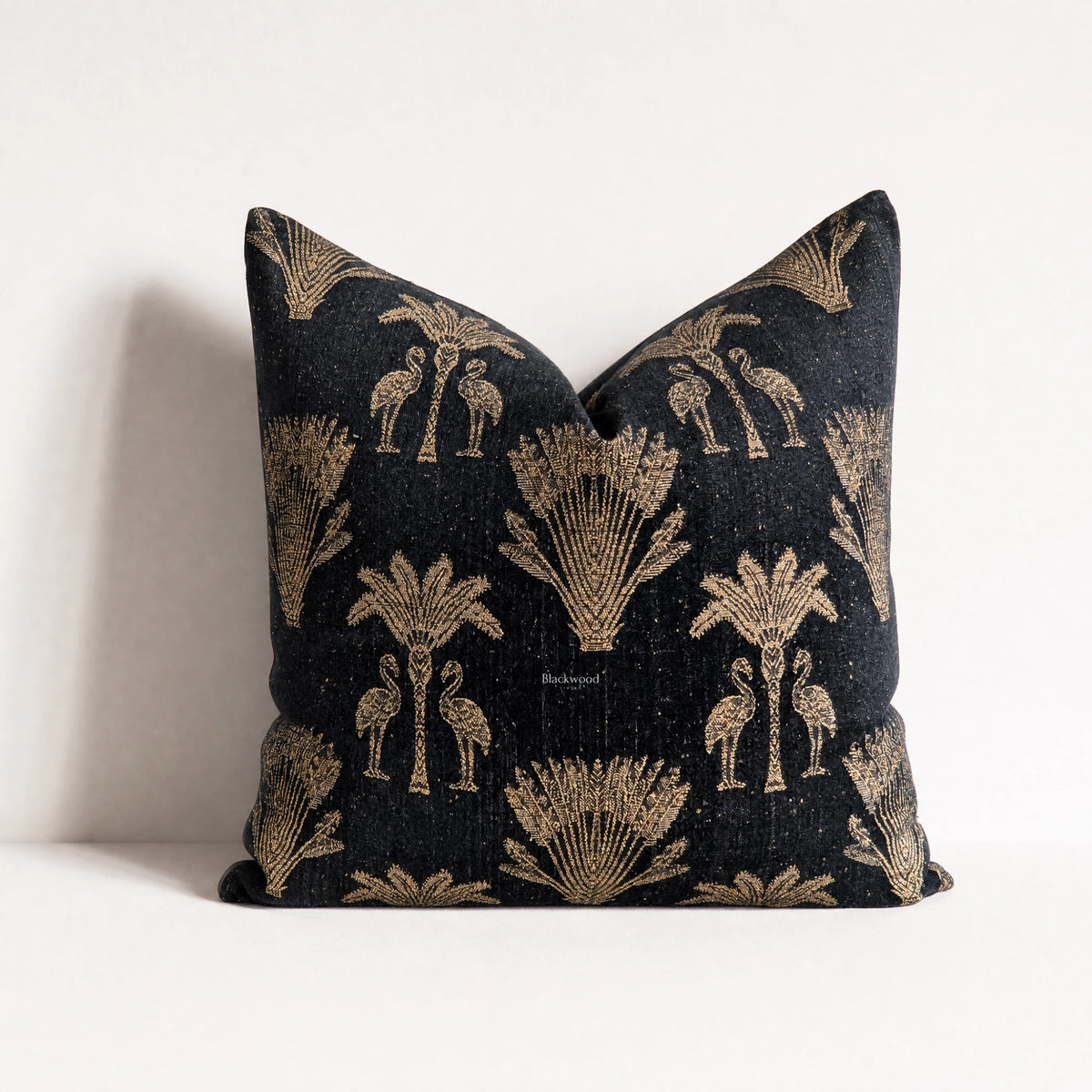 Palm Cushion Cover 55cm, black fabric with gold palm and flamingo motifs in a vintage tropical design.