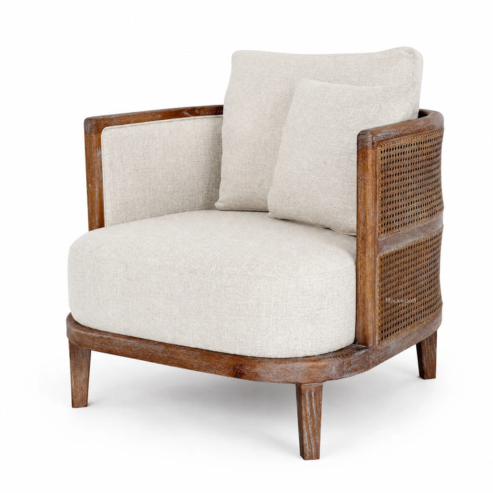 Seabrooke Chair with solid oak frame, handwoven natural rattan panels, and linen cushions.
