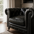 Ashcroft Armchair - Estate Black: Chesterfield leather, top-grain South American, with tufting and nailhead trim.