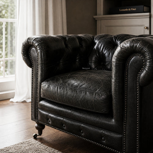 Ashcroft Armchair - Estate Black: Chesterfield leather, top-grain South American, with tufting and nailhead trim.