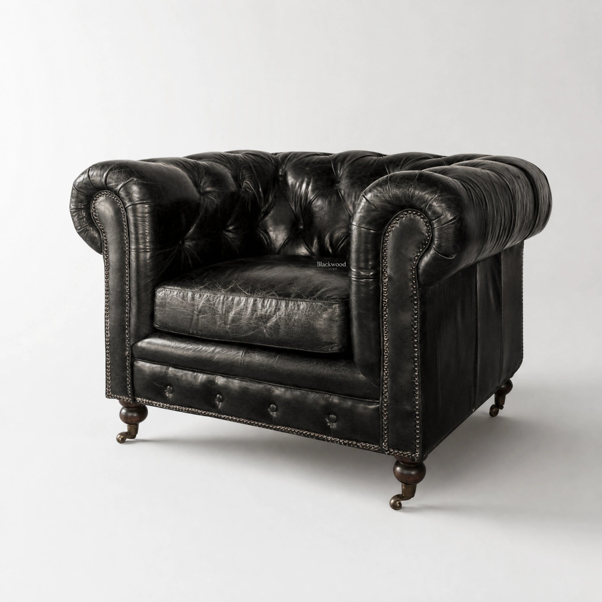 Ashcroft Armchair, Estate Black leather with Chesterfield button tufting and nailhead trim.