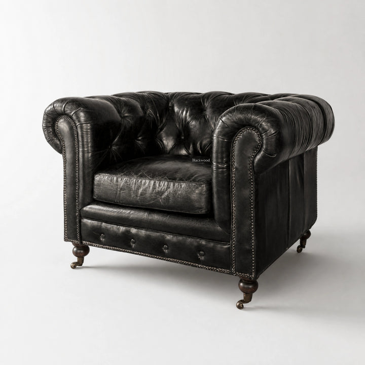 Ashcroft Armchair, Estate Black leather with Chesterfield button tufting and nailhead trim.