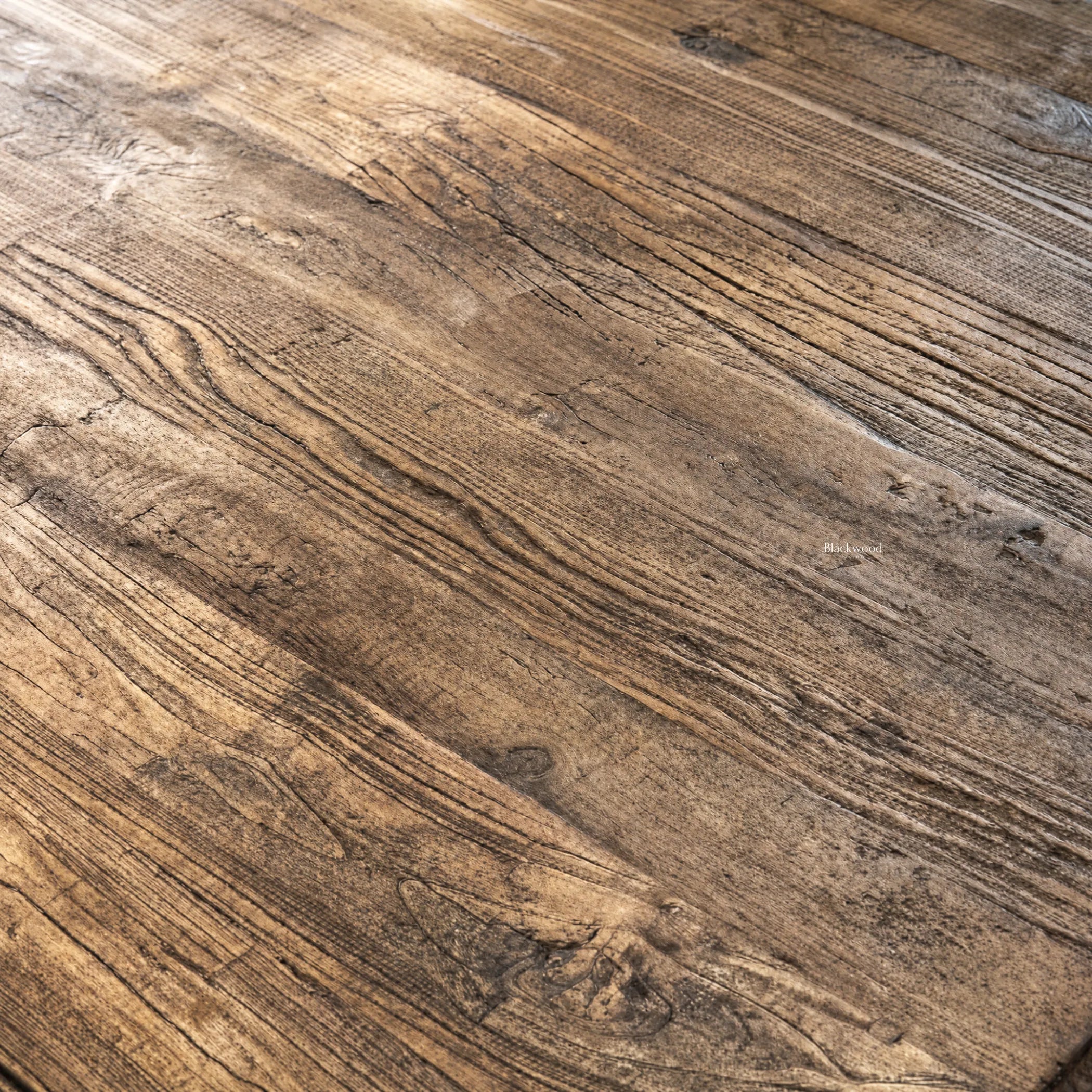 Provence Dining Table top in reclaimed elm with a weathered finish and rich grain.