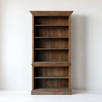 Wycliffe Bookcase in recycled pine with textured finish; tall, warm, substantial shelving unit with detailing.