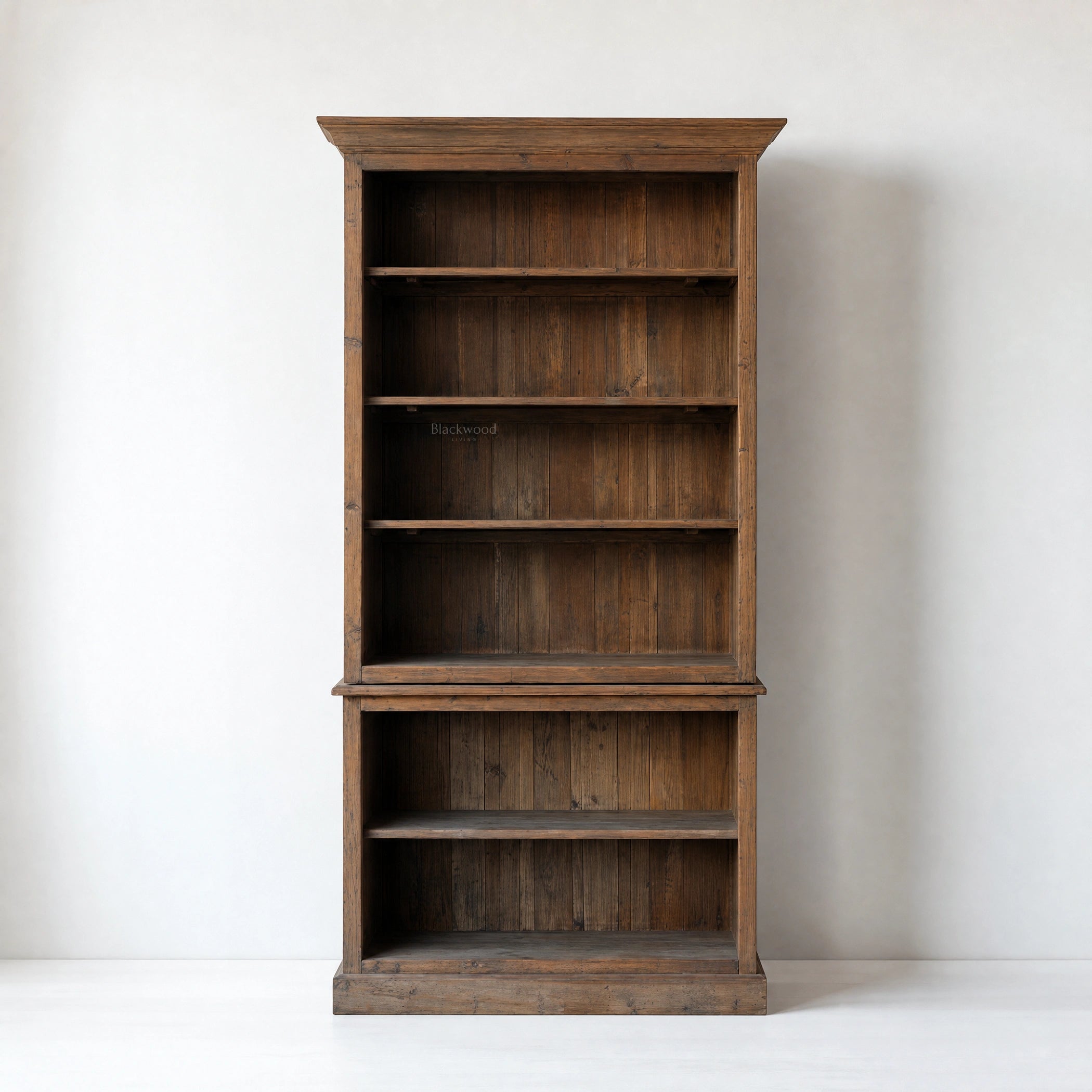Wycliffe Bookcase in recycled pine with textured finish; tall, warm, substantial shelving unit with detailing.