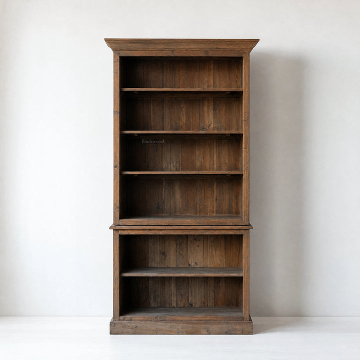 Wycliffe Bookcase in recycled pine with textured finish; tall, warm, substantial shelving unit with detailing.