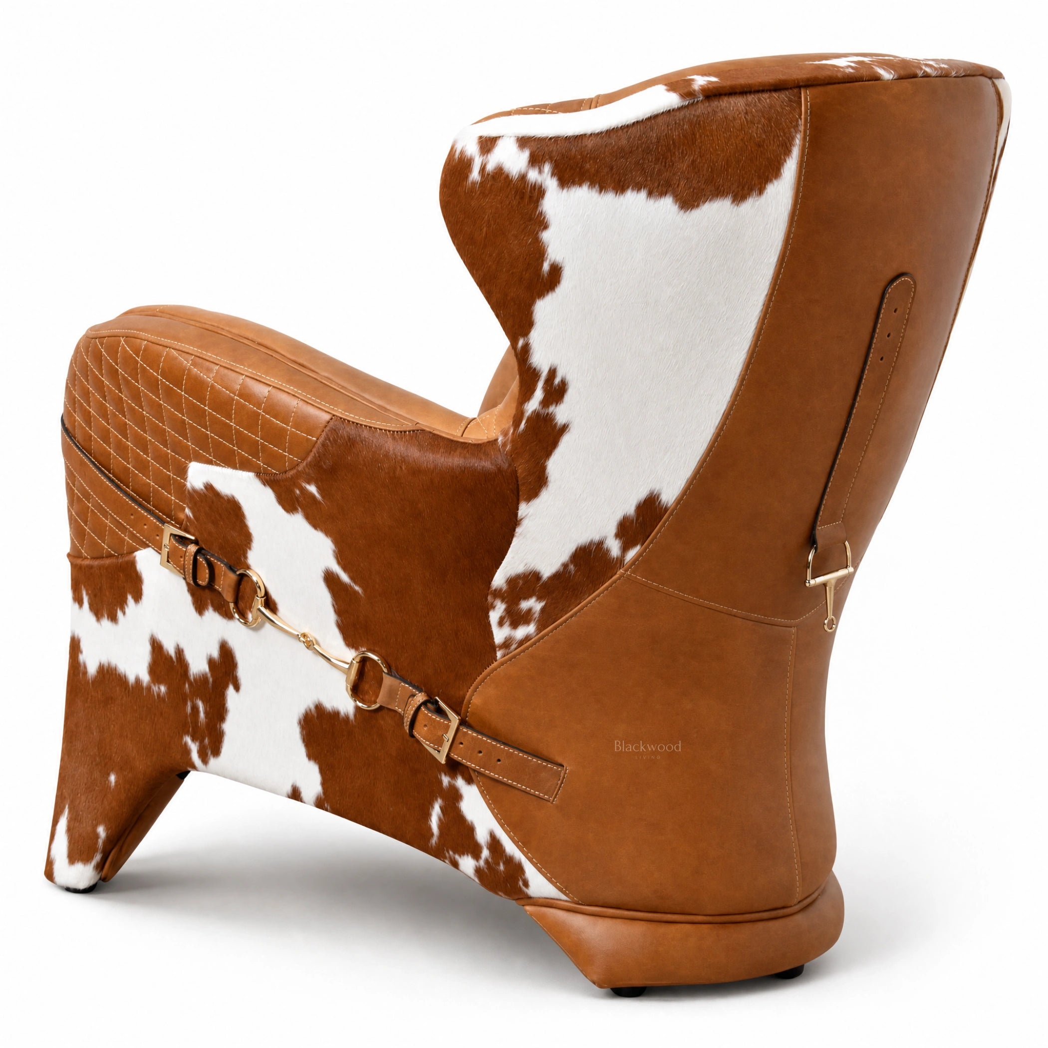 The Huntsman Chair: brown leather with cowhide patches, quilted diamond seat, saddle straps, and gold hardware.