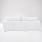 Nantucket Slipcover 3-Seat Sofa in a linen-cotton blend with grey pinstripes on a light backdrop.