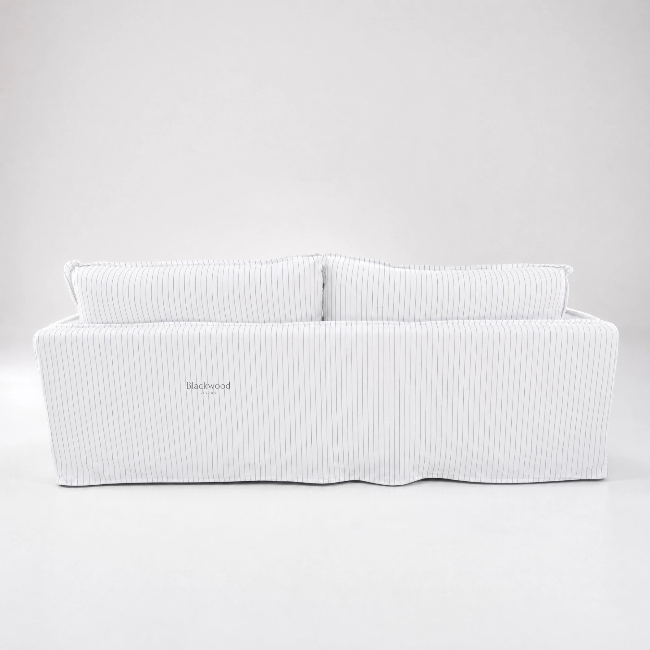 Nantucket Slipcover 3-Seat Sofa in a linen-cotton blend with grey pinstripes on a light backdrop.