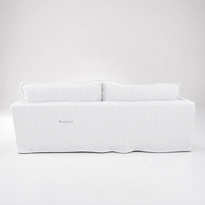 Nantucket Slipcover 3-Seat Sofa in a linen-cotton blend with grey pinstripes on a light backdrop.